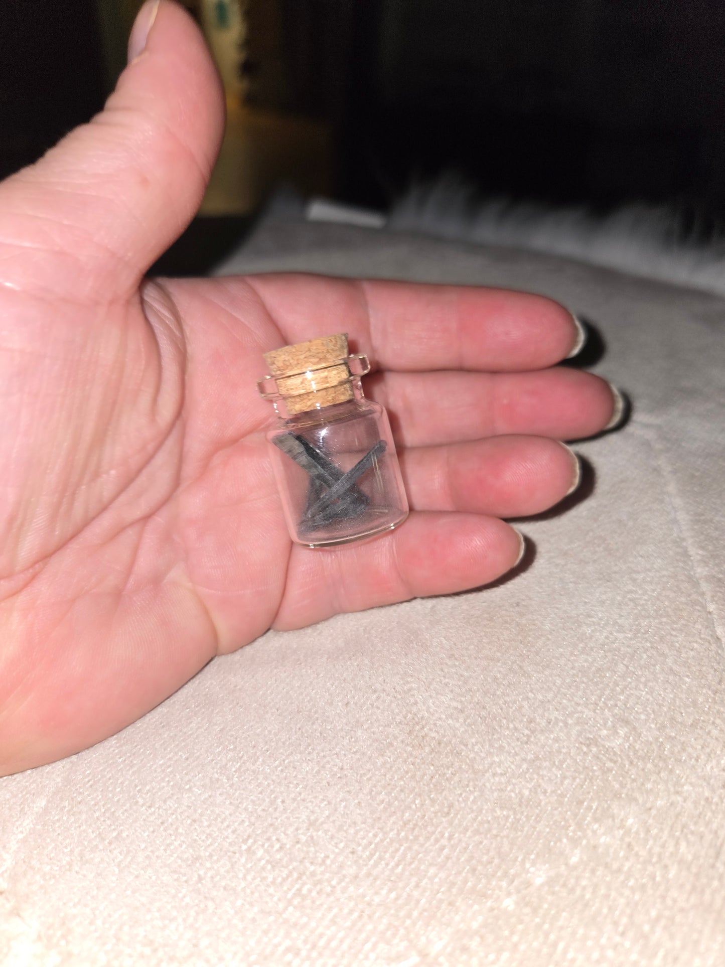 Vivianite specimen in jar