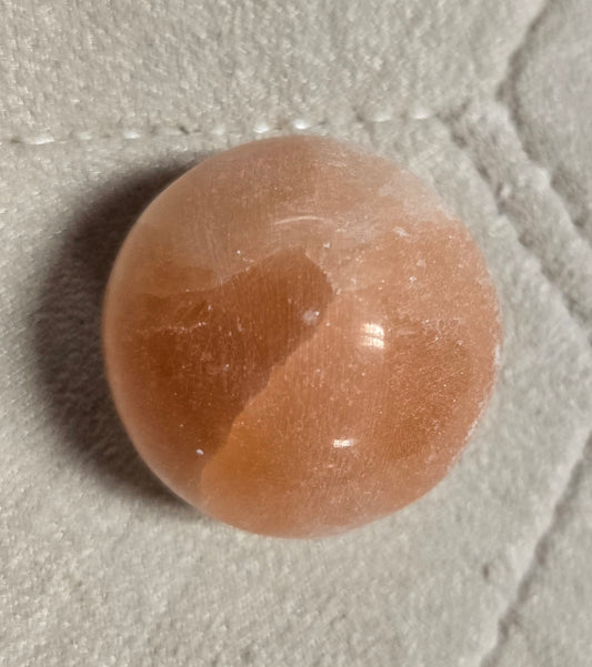 Peach selenite sphere